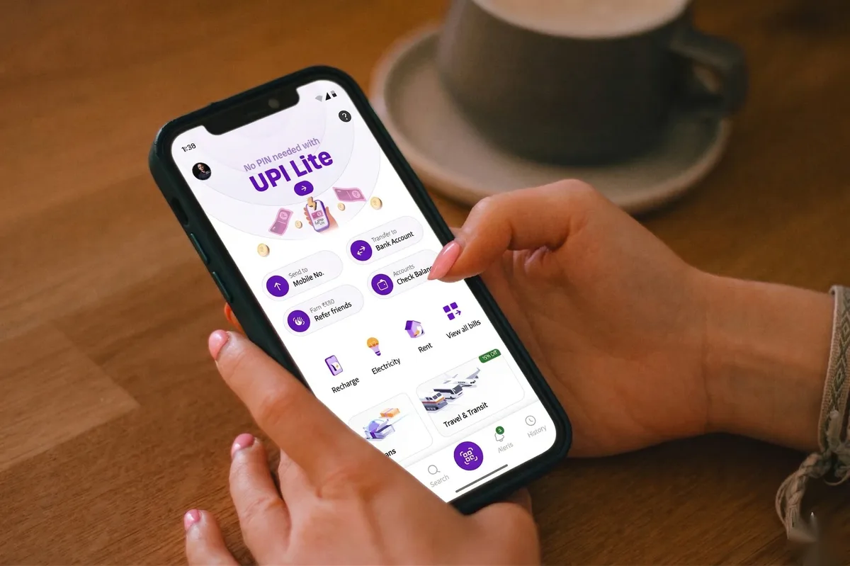 PhonePe app in hand